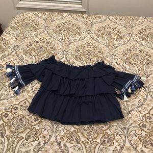 Over the shoulder blue top